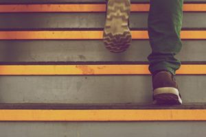 man walking up steps
