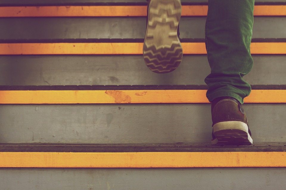 man walking up steps