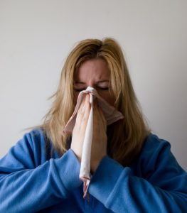 Woman sneezing
