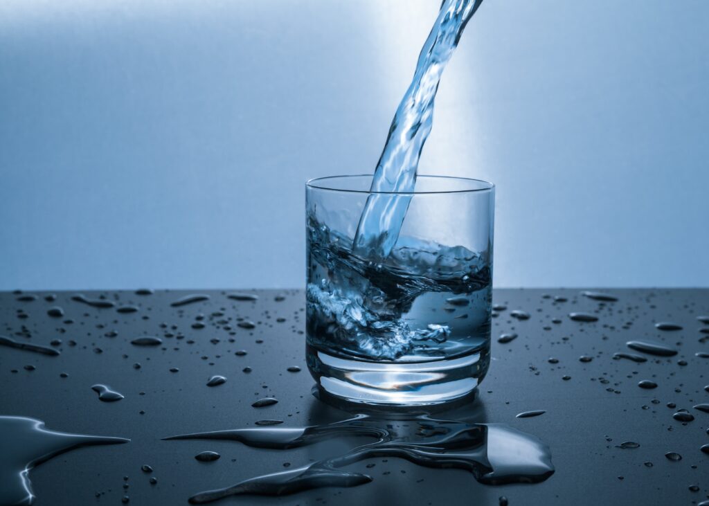 water filling a glass cup