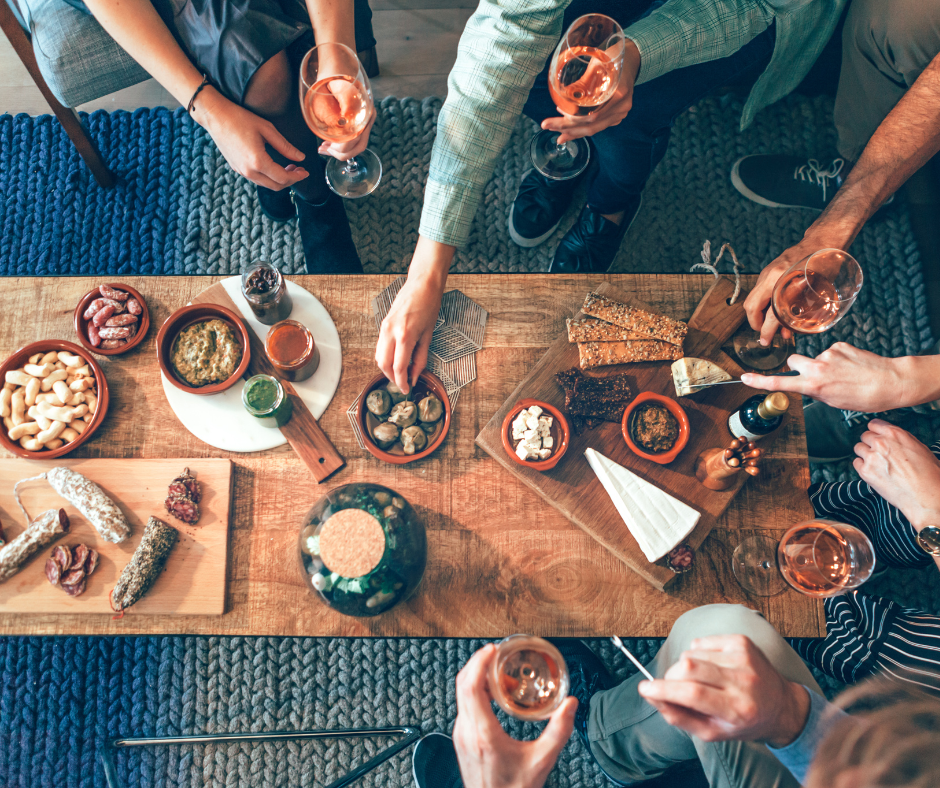 group gathered around table eating